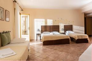 Posteľ alebo postele v izbe v ubytovaní Ammon Garden Hotel + 37 fotografií