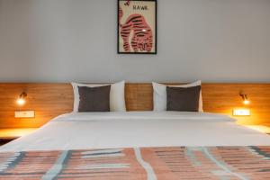 Postel nebo postele na pokoji v ubytování Hotel Memoir Kazbegi by DNT Group