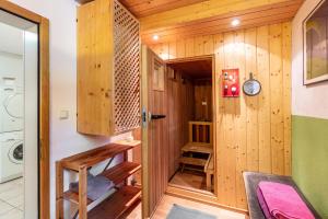 a tiny house with wood paneling and a hallway at Kammbühlhof in Menzenschwand