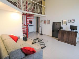 a living room with a couch and a tv at Apartment Gardenia by Interhome in Verbania