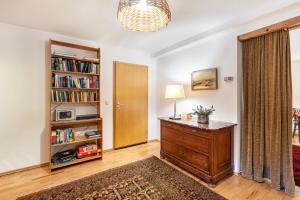 a room with a dresser and a book shelf at Kammbühlhof in Menzenschwand