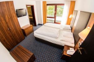 Postel nebo postele na pokoji v ubytování Hotel Stuttgart 21