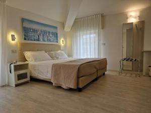 Posteľ alebo postele v izbe v ubytovaní Hotel Villa Anthea + 37 fotografií