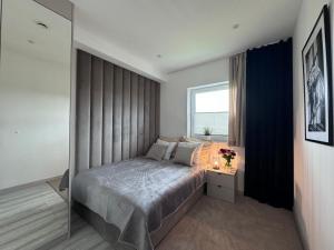 Postel nebo postele na pokoji v ubytování Apartament z Jacuzzi