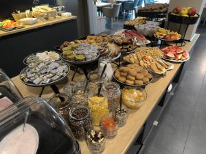 a buffet line with many different types of food at Avenue Pallova 28 in Plzeň