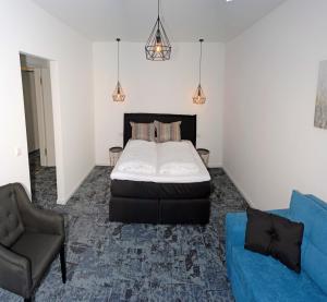 Un pat sau paturi într-o cameră la Das Haus am See