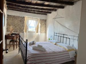 Katil atau katil-katil dalam bilik di Agriturismo B&B Luna di Quarazzana in Fivizzano Tuscany