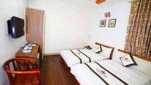 Voodi või voodid majutusasutuse Phuong Dong hotel toas