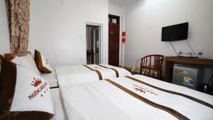 Voodi või voodid majutusasutuse Phuong Dong hotel toas