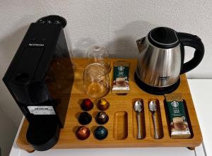 a wooden tray with a coffee maker and a blender at Select Cunda Guest House - Sea View Room with Private Veranda in Cunda Island in Ayvalık
