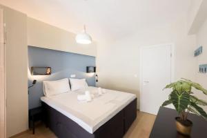 Ένα ή περισσότερα κρεβάτια σε δωμάτιο στο Three Bedroom Stylish Apt next to Acropolis