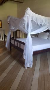 Postel nebo postele na pokoji v ubytování Secrets Guest House Entebbe