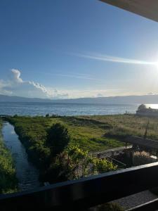 a view of the ocean from a balcony at Apartman Lili in Ohrid +8 photos