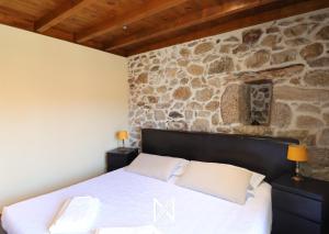 Ένα ή περισσότερα κρεβάτια σε δωμάτιο στο MyStay - Casa do Alpendre +46 φωτογραφίες