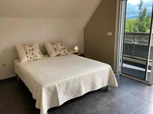 Postel nebo postele na pokoji v ubytování Agréable appartement t2 à St leu