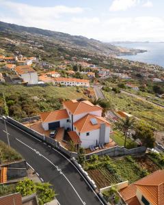 an aerial view of a village with a road at Casa do Mundo Madeira in Gaula