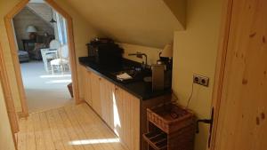 a kitchen with a counter top in a house at Alte Schäferei - Schäferstube in Lüdersburg