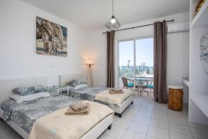 Postel nebo postele na pokoji v ubytování Lisabeth Apartments + 37 fotografií