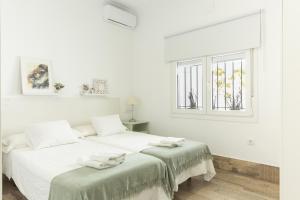 Posteľ alebo postele v izbe v ubytovaní Precioso apartamento con Chimenea patio solarium