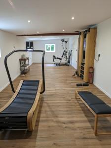 a gym with two treadmills and a treadmill at Natures-Rest Wielen in Wielen