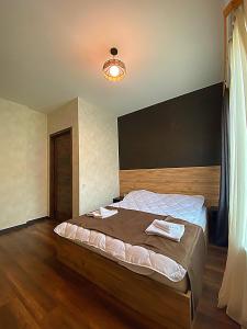 Voodi või voodid majutusasutuse TwinSide Chalet Bakuriani toas