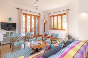 a living room with a couch and chairs and a table at Boreal in Alcudia
