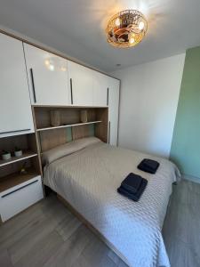 a bedroom with a bed with two towels on it at Casa Duseña Luna in Hondón de las Nieves +28 photos