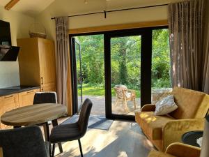 a living room with a couch and a table at Labieši in Jūrmala