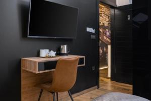 Televízia a/alebo spoločenská miestnosť v ubytovaní Top rooms
