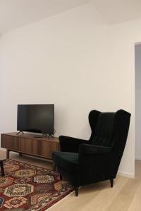 TV a/nebo společenská místnost v ubytování Testaccio's Heart