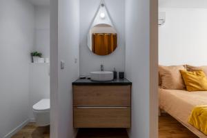 a bathroom with a sink and a mirror at La maison des canailles in Cassis +28 photos