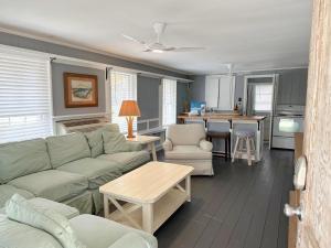 a living room with a couch and a kitchen at NH311B Nags Head 311B in Nags Head