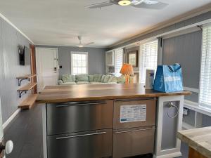 a kitchen with a counter top and a couch at NH311B Nags Head 311B in Nags Head