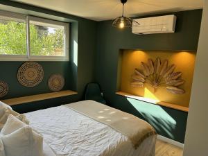 Posteľ alebo postele v izbe v ubytovaní Appartement Proche Hôpital, Jardin privatif