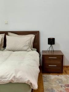 Säng eller sängar i ett rum på Apartament Victoria