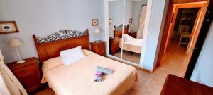 Posteľ alebo postele v izbe v ubytovaní VV Los Balconcitos 21 "by henrypole home"