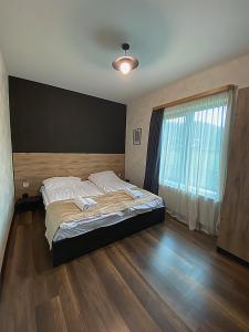 Voodi või voodid majutusasutuse TwinSide Chalet Bakuriani toas