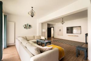 a living room with a couch and a table at TACHE APARTMENTS 2 in Poiana Brasov