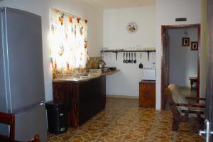 a kitchen with a counter and a sink in it at Ditsem Guest Farm in Upington