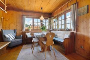 a dining room with a table and a chair at Ferienhaus Charlotte in Zell am Harmersbach