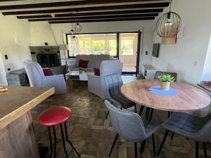a living room with a table and chairs at EifelSeensucht in Heimbach