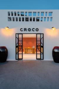 an entrance to a store with an open door at Croco Mykonos in Tourlos