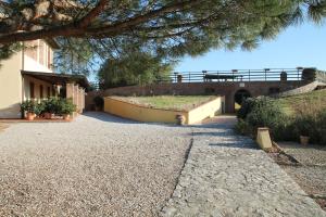 a large building with a garden on the side of it at Agriturismo Le Docce in Castelfiorentino