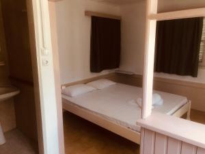 a small room with two bunk beds in it at Barreira Beachfront Rooms 4 in Kalamata +10 photos