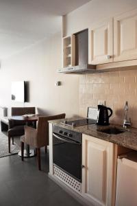 Afbeelding uit fotogalerij van Las Bayas Home Suites in Esquel +16 foto's