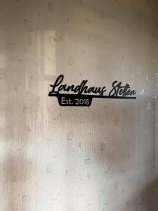 a sign for a lamborghini station on a wall at Landhaus Stetten in Stetten