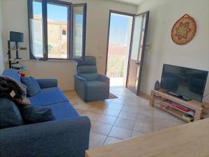 Televízia a/alebo spoločenská miestnosť v ubytovaní La Ciaccia - appartement vue mer