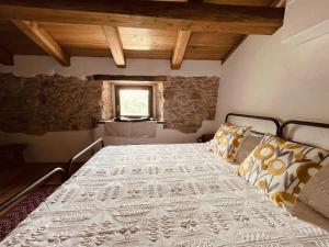 Postel nebo postele na pokoji v ubytování Casa Asproni