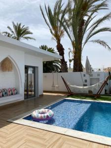 Bazén v ubytování Villa Papaya - Djerba nebo v jeho okolí