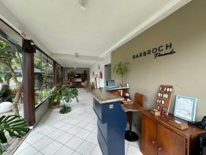 a lobby of a barber shop with a counter at Pousada Barbroch in Florianópolis